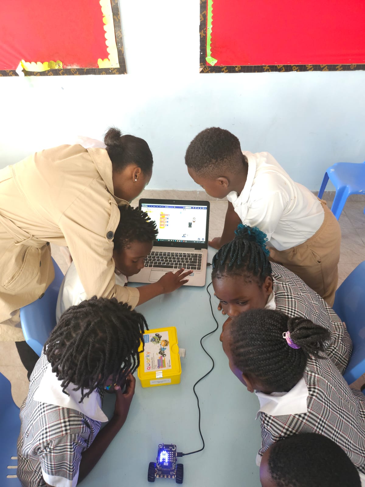 Students learning robotics at Akili Nest